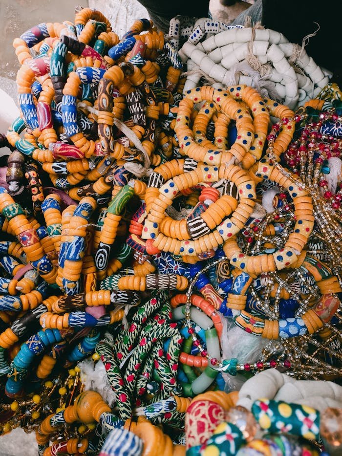 A vibrant assortment of handmade African beaded bracelets showcasing intricate designs and vivid colors.